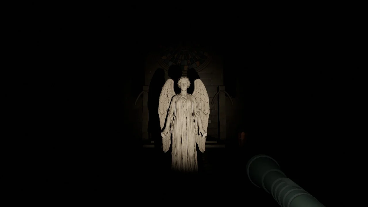 A stone angel illuminated by a flashlight in the dark chapel of Don’t Look Away