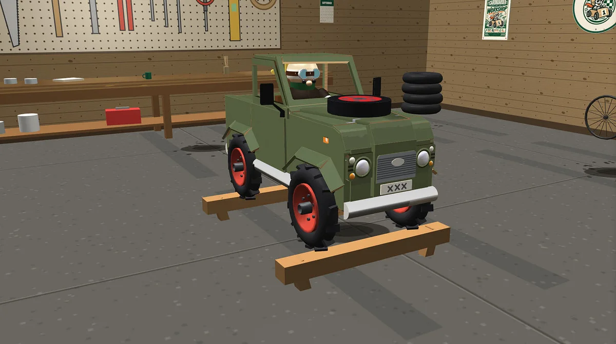 A homemade green soapbox racer on a stand inside the Cardboarder workshop
